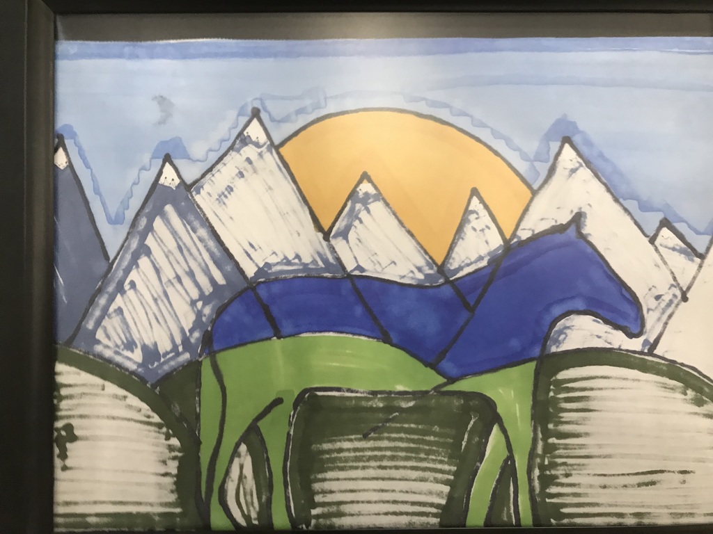 A horse with mountains in the background
