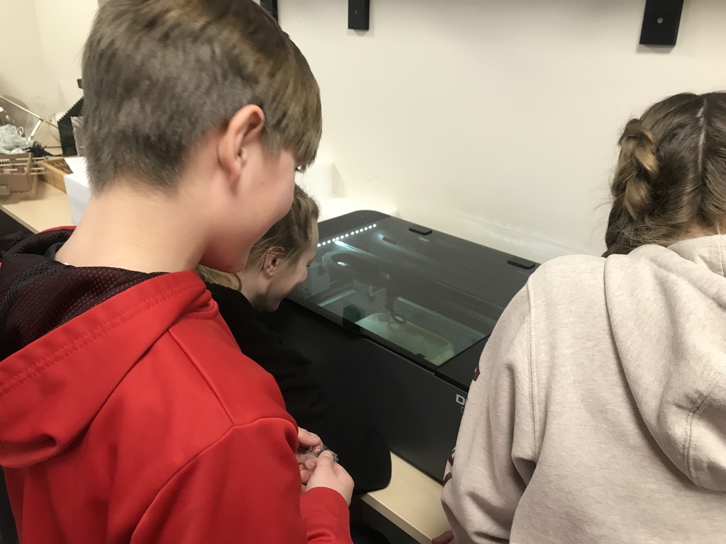 students with laser engraver